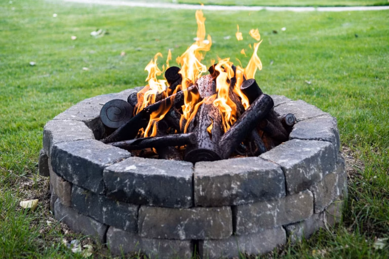 Custom stone fire pit installation by DG Picture Perfect Landscaping in Curryahoga and Geauga County, Ohio