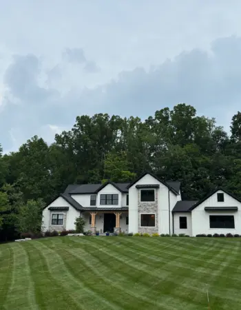 Freshly mowed and striped residential lawn maintained by DG Picture Perfect Landscaping in Cuyahoga County Ohio
