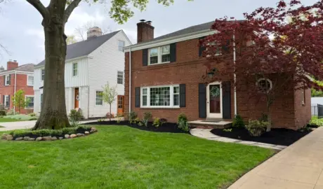 Residential landscaping with fresh mulch beds, trimmed shrubs, and curb appeal enhancement in Northeast Ohio