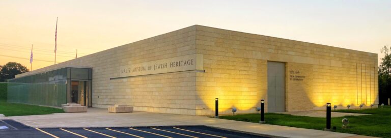 Maltz Museum of Jewish Heritage entrance in Beachwood with lawn and trees at dusk