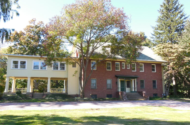 Greenwood Farm historic house in Richmond Heights framed by large mature trees