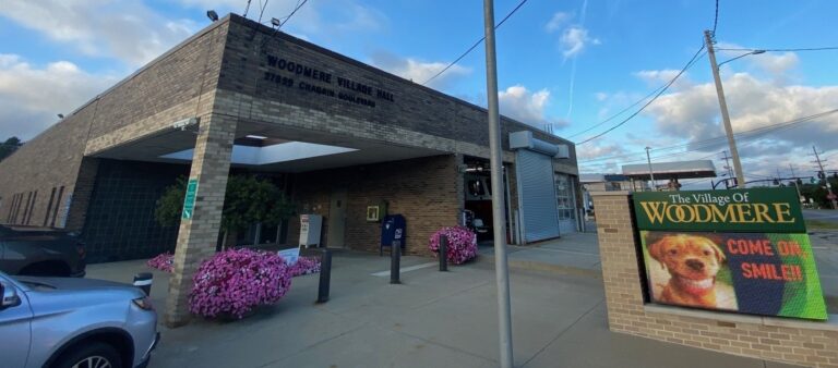 Woodmere Village Hall with flowering landscaping in front